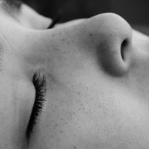 Up-close shot of a calm face during a meditation breathing.